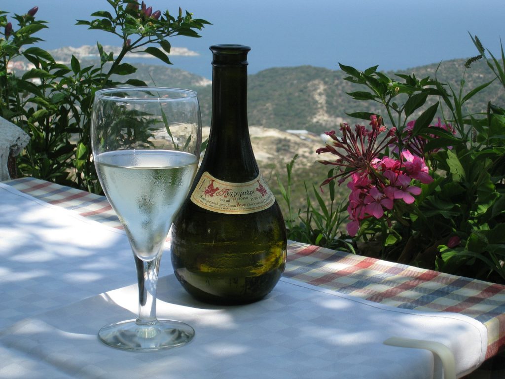 bottle of retsina wine on a hillside in Greece